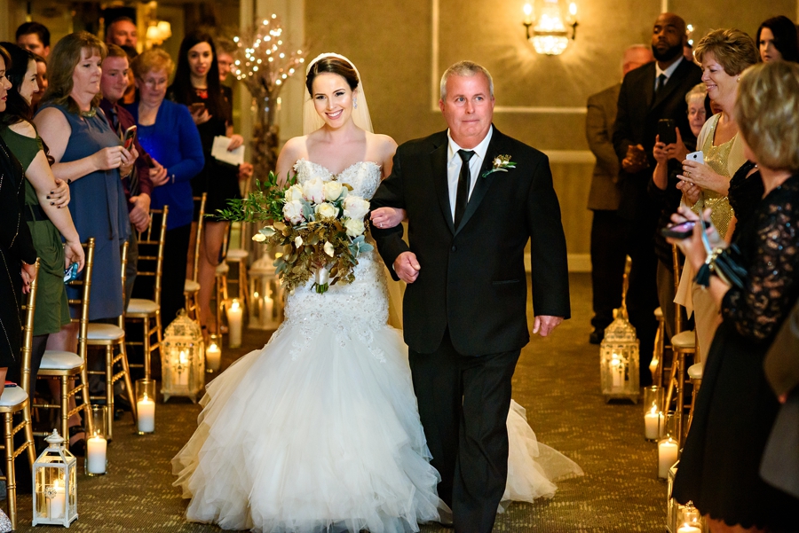 The father of the bride walks his daughter down the isle.